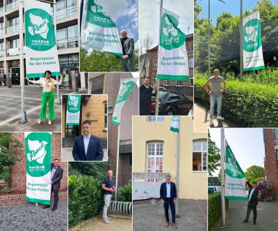 Collage mit Bürgermeistern und Flaggen "Mayors for peace"
